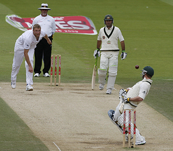 England's Andrew Flintoff testing Phillip Hughes' technique against fast, short-pitched bowling